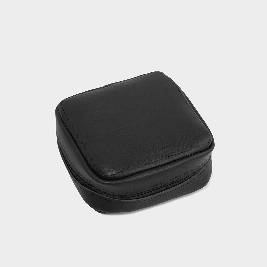 Closed black leather Mac Mini case, focusing on the sleek and minimalist exterior