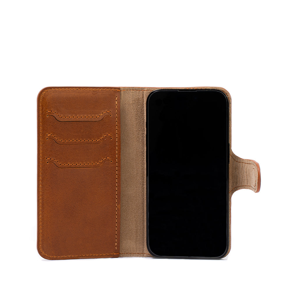 Open view of tan iPhone 16 case wallet folio, Classic 4.0, displaying card slots and secure magnetic strap closure