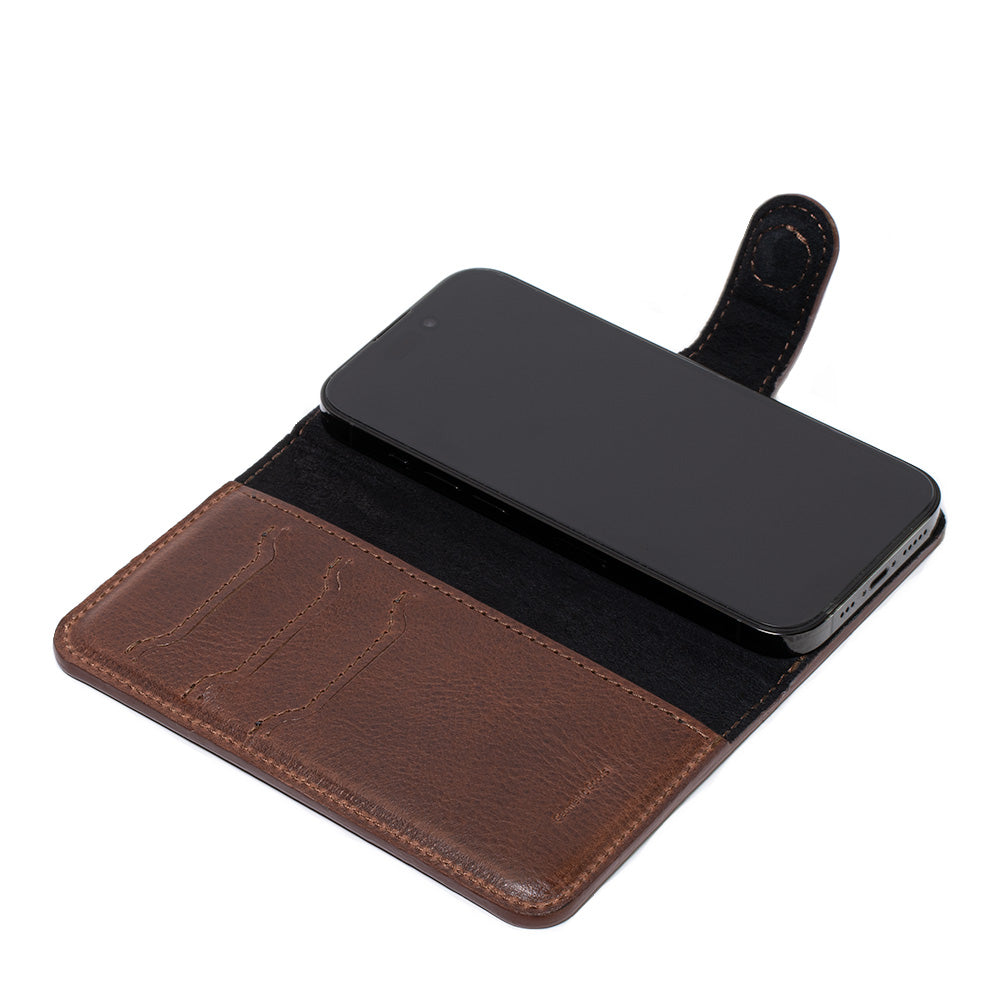 Side view of mahogany iPhone 16 folding case wallet, Classic 4.0, with phone partially inserted and magnetic strap open