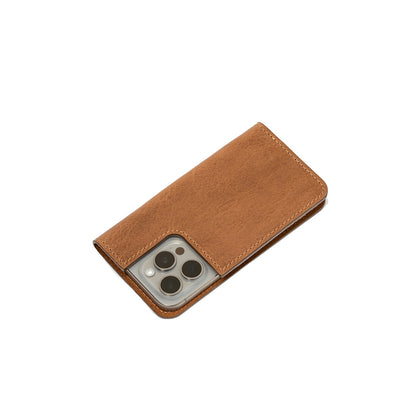 Back side view of a brown leather iPhone 16 folio case, highlighting its smooth texture and stylish design.