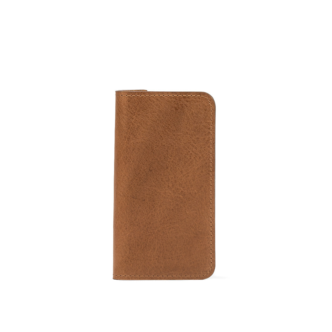 Front side view of a brown leather iPhone 16 Pro folio case, showcasing its sleek design and high-quality material.