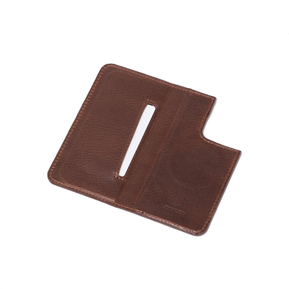 Unfolded view of the mahogany iPhone 16 folio wallet case, The Minimalist 3.0, showing the interior card slot and MagSafe feature