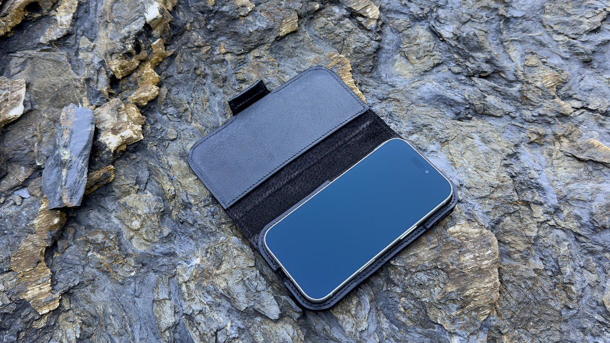 Open black Classic 5.0 folio wallet for iPhone 18 Pro and Pro Max showing suede lining and magnetic closure
