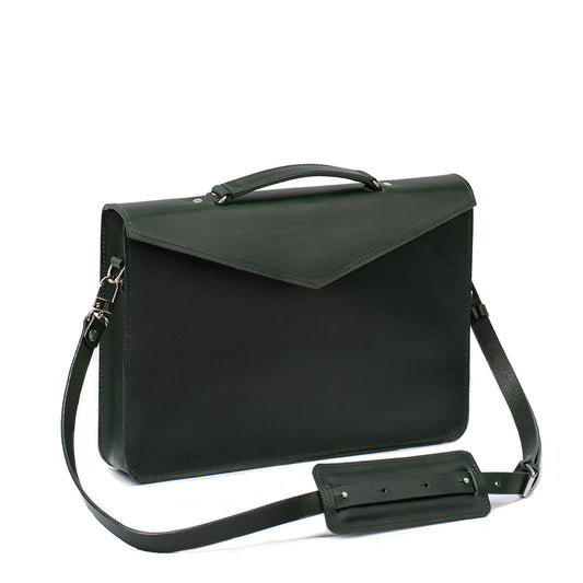 Green female briefcase in premium leather, designed as a sophisticated laptop bag for women with secure compartments and adjustable straps