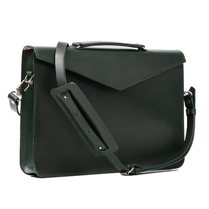Chic female briefcase in green, crafted from premium leather, suitable for carrying laptops and essentials in organized compartments.