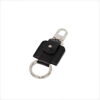 AirTag keychain with a convenient snap hook and keyring attachment made from Italian full-grain vegetable-tanned leather in black color