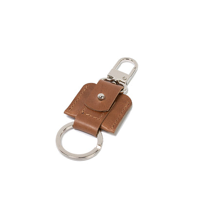 AirTag keychain with a convenient snap hook and keyring attachment made from Italian full-grain vegetable-tanned leather in brown color