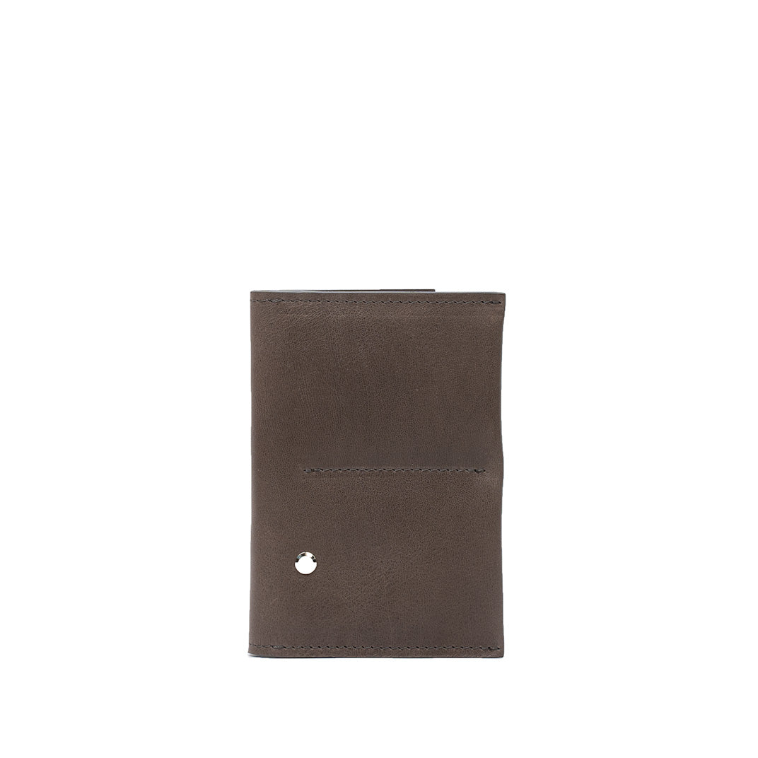 Leather AirTag passport holder 2.0 in gray color highlighting its compact and functional design.