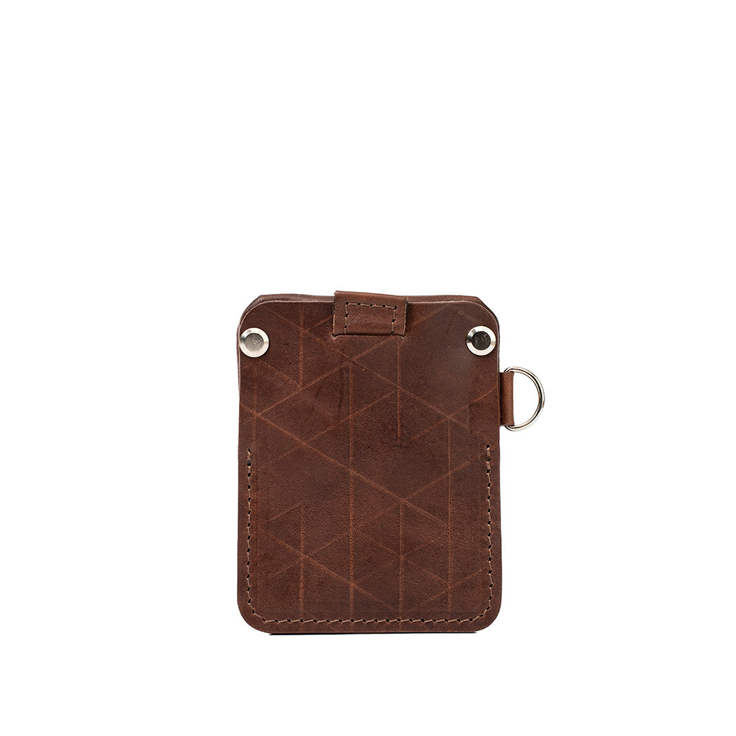 Mahogany leather AirTag wallet by Geometric Goods with geometric pattern, D-ring, and rear card slot