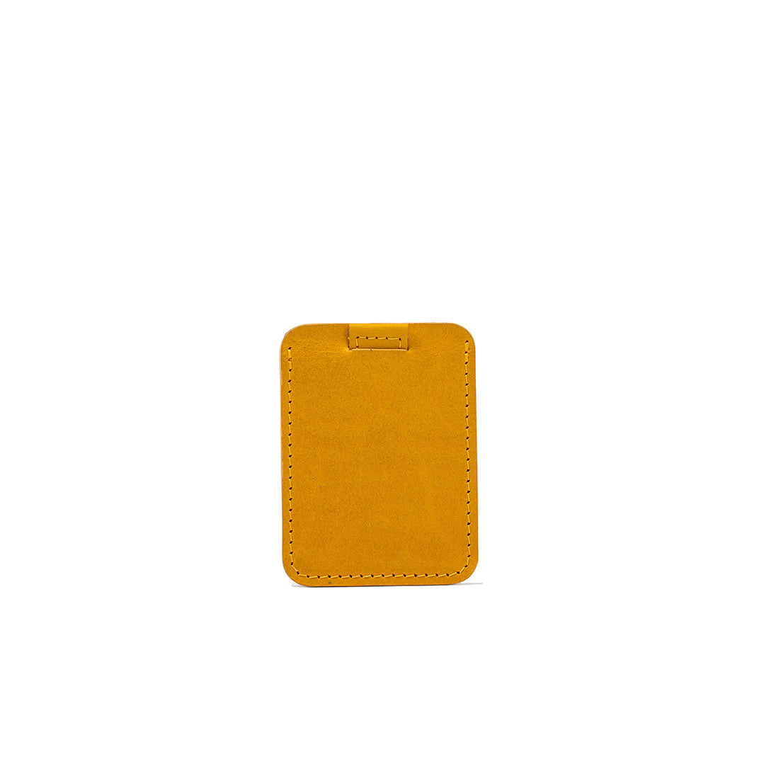 Designer mustard yellow leather cardholder, slim design with precision stitching, ideal for credit card storage