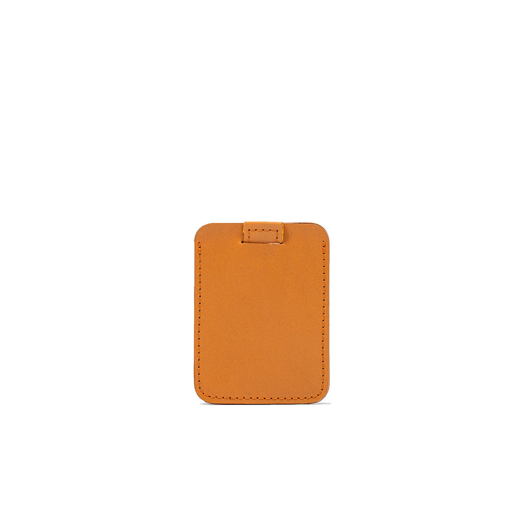 Designer orange leather cardholder, slim and minimalist style with precise stitching, perfect for carrying credit cards