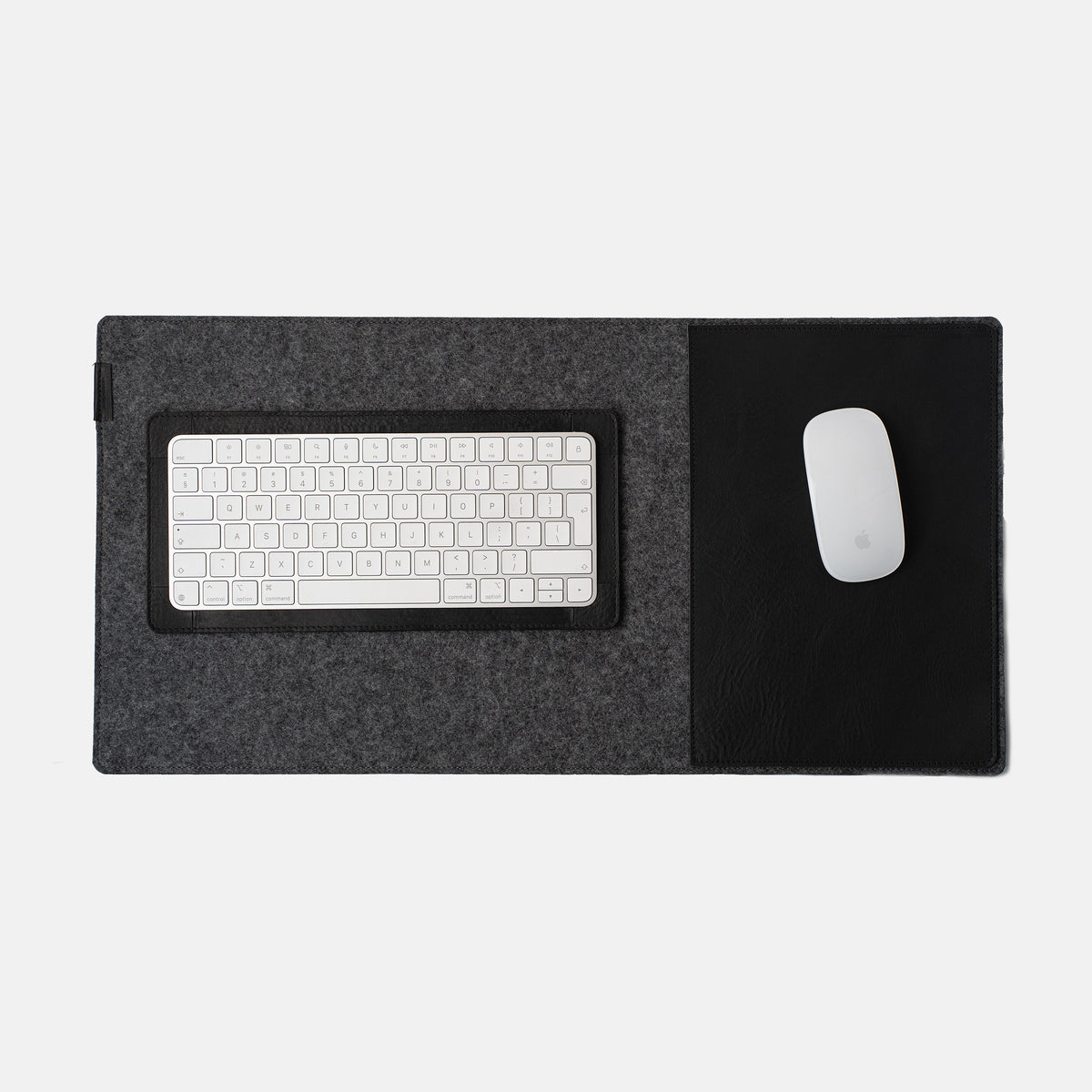 Leather desk setup with full-grain leather desk pad and Magic Keyboard tray