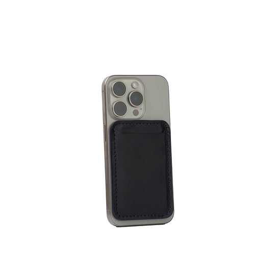 Navy blue top-grain leather MagSafe wallet for iPhone, classic design, handcrafted from Italian leather, shown on iPhone 16 Pro