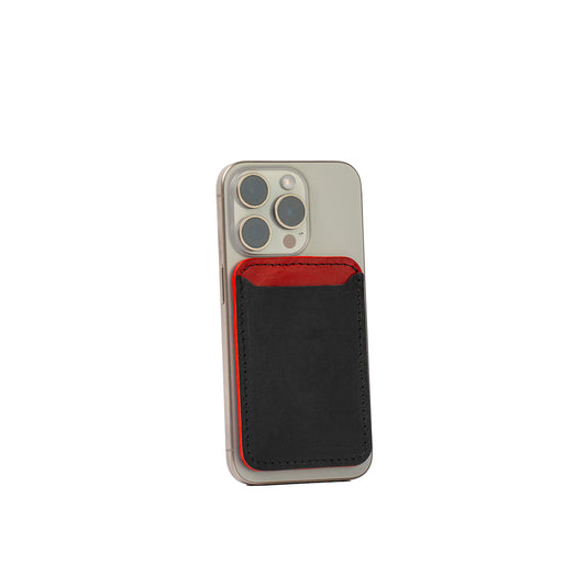 Two-tone MagSafe wallet for iPhone in black and red, luxury Italian leather, minimalist card holder with bold contrast design, handcrafted for secure fit