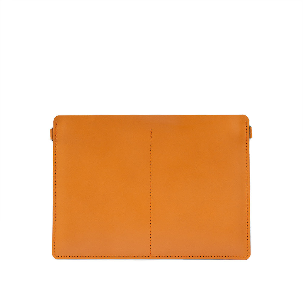 leather bag sleeve for MacBook Pro "The Minimalist 4.0" made by Geometric Goods from vegetable tanned leather in orange (deep saffrone) color