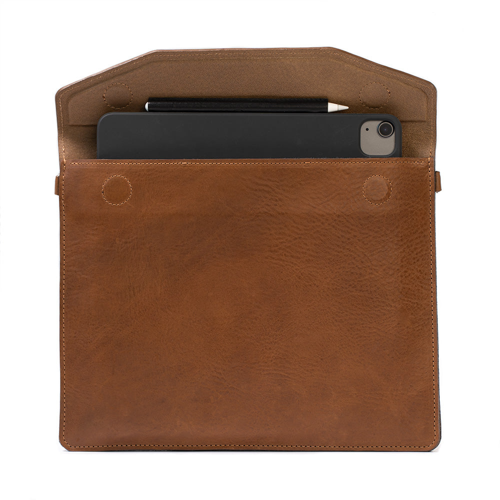 photo of premium sleeve with adjustable strap for iPad series (Air, Pro) made by Geometric Goods from Italian full-grain veg-tanned leather in brown color