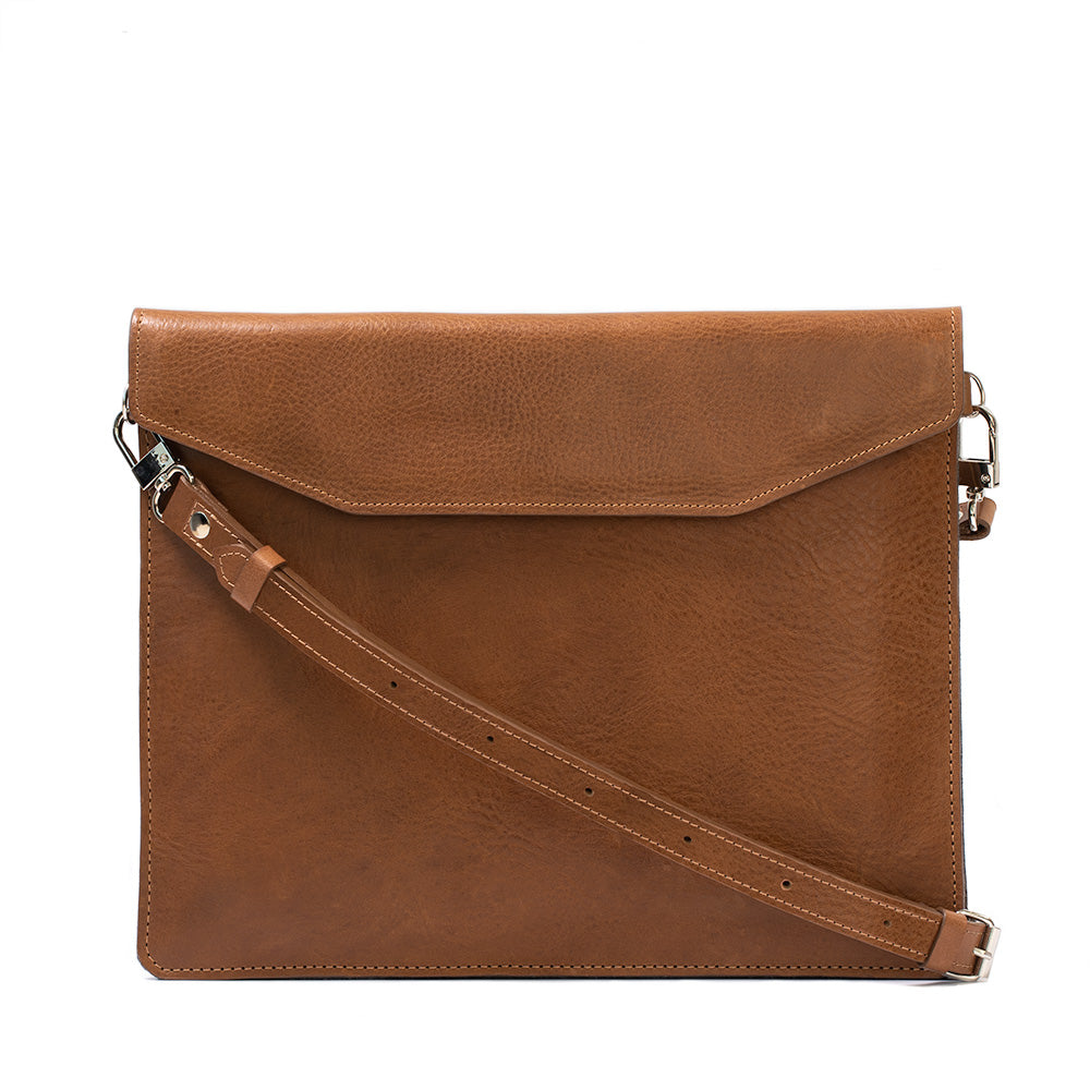 Premium bag with adjustable strap for MacBook series (Air, Air 15, Pro 13, Pro 14, Pro 15, Pro 16) made by Geometric Goods from Italian full-grain veg-tanned leather in brown color