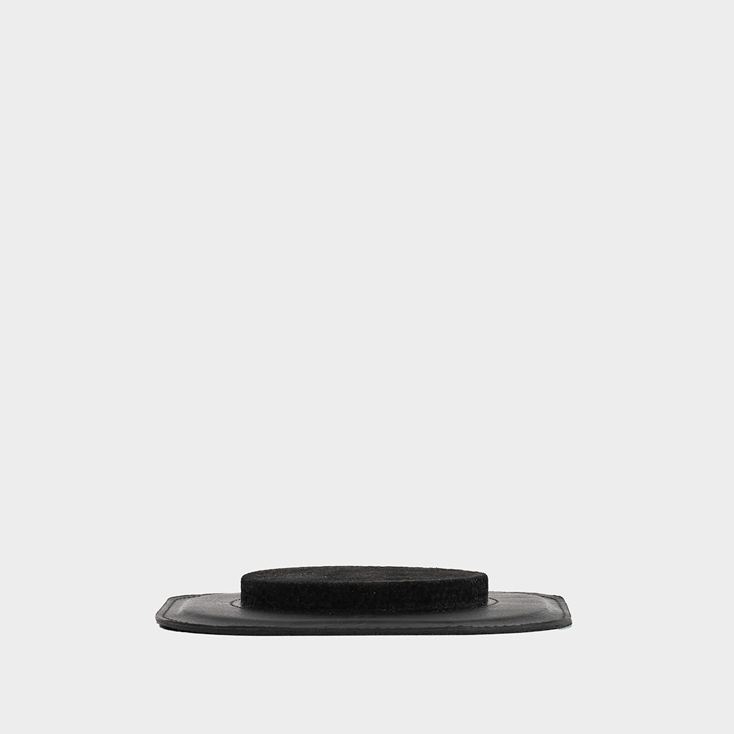 Sleek and compact black leather Mac Mini  M4 stand for desk setups, highlighting its elegant and functional design