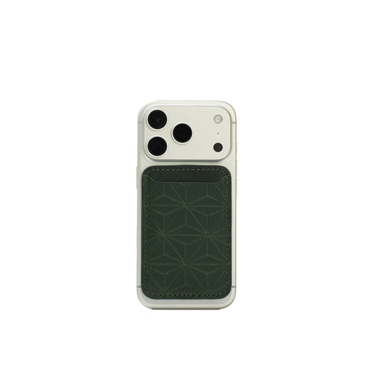MagSafe leather wallet in Forest Green, handcarved Geometric Flower pattern on iPhone 17 Pro — Italian veg-tanned leather, holds 2–3 cards, Apple-approved magnet