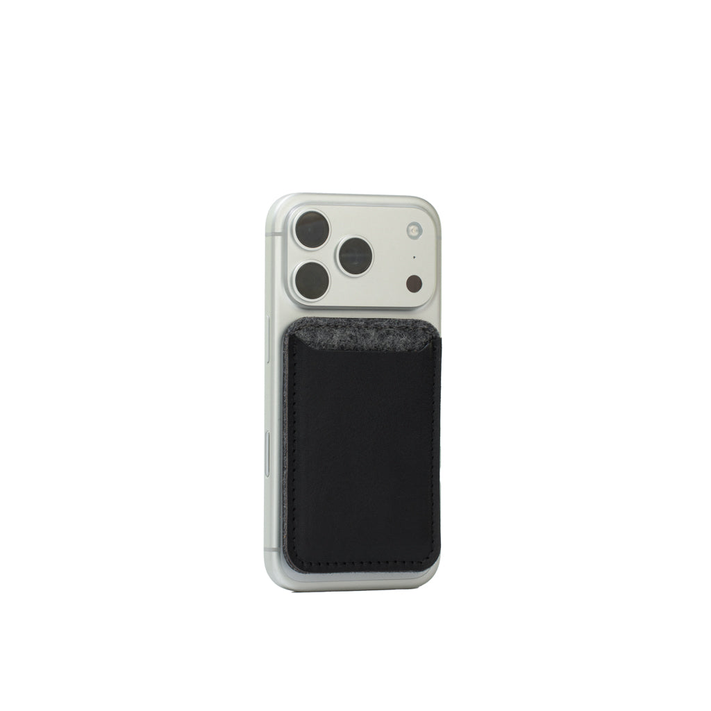 MagSafe leather wallet — Merino edition in black with grey wool felt top on iPhone; Italian full-grain leather, 2–3 card capacity, Apple-approved magnet