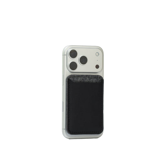MagSafe leather wallet — Merino edition in black with grey wool felt top on iPhone; Italian full-grain leather, 2–3 card capacity, Apple-approved magnet