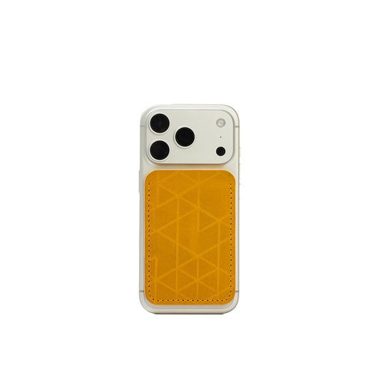 MagSafe leather wallet in yellow “Vectors” on iPhone — full-grain Italian veg-tanned leather, holds 2–3 cards, Apple-approved strong magnet
