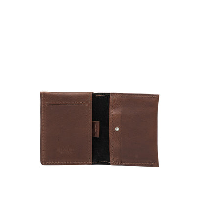 Open view of mahogany leather AirTag card wallet displaying card slots and secure pocket