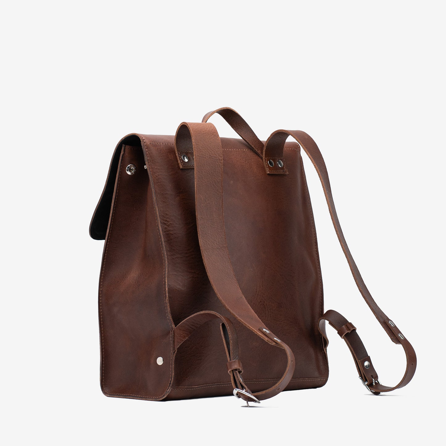 Rear three-quarter view of the mahogany Leather Backpack – Fibonacci showing the shoulder straps, side gusset and top handle