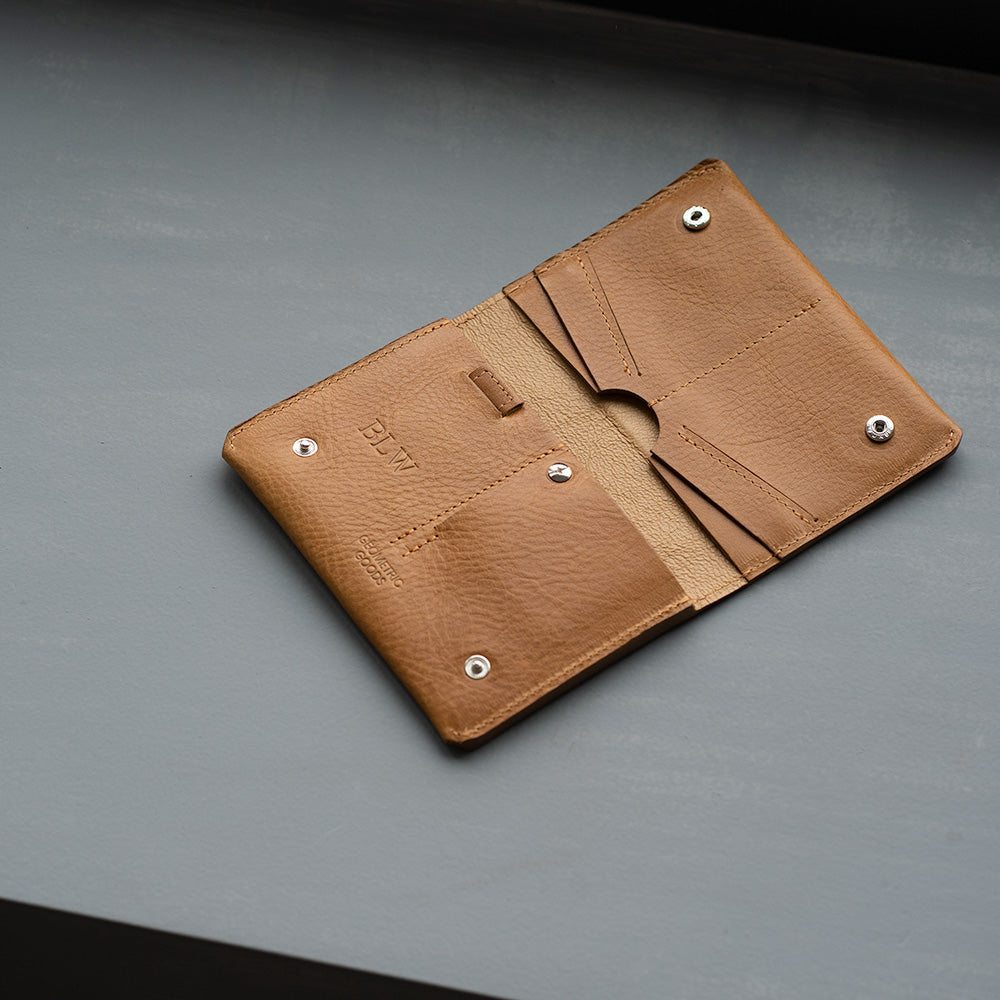 personalisation of light brown leather AirTag Passport Travel Wallet by Geometric Goods.jpg