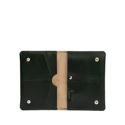 AirTag passport wallet for women in premium forest green, crafted by Geometric Goods from Italian leather.