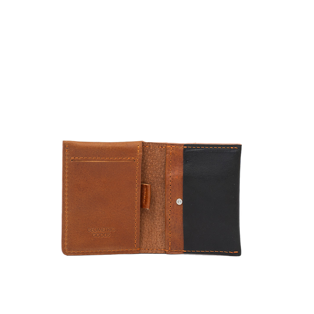 Open view of tan and black leather AirTag card wallet showing card slots and hidden compartment