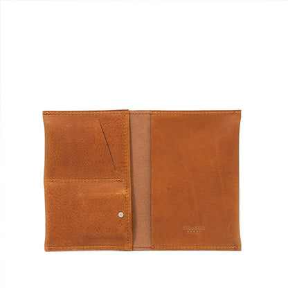 Tan leather AirTag passport holder 2.0 combining functionality and elegance