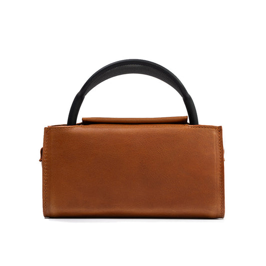 Elegant tan handbag for AirPods Max, with secure magnetic closures.