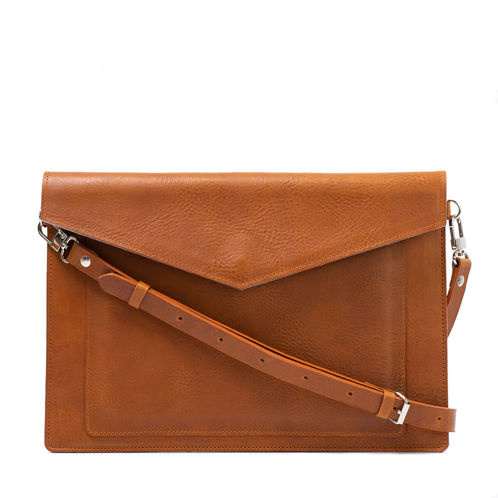 tan color leather sleeve bag case for macbook made from premium Italian leather with zipper pocket and iPad pocket with adjustable strap