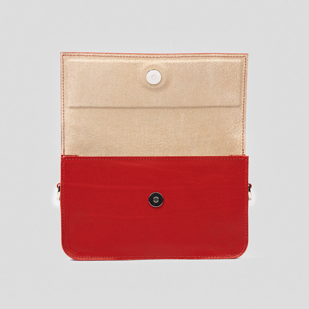 elegant red leather shoulder bag for woman with adjustable strap on magnet closure
