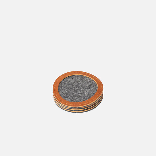 Stacked round wool felt coasters with tan leather rims, 3.86 in (98 mm) diameter