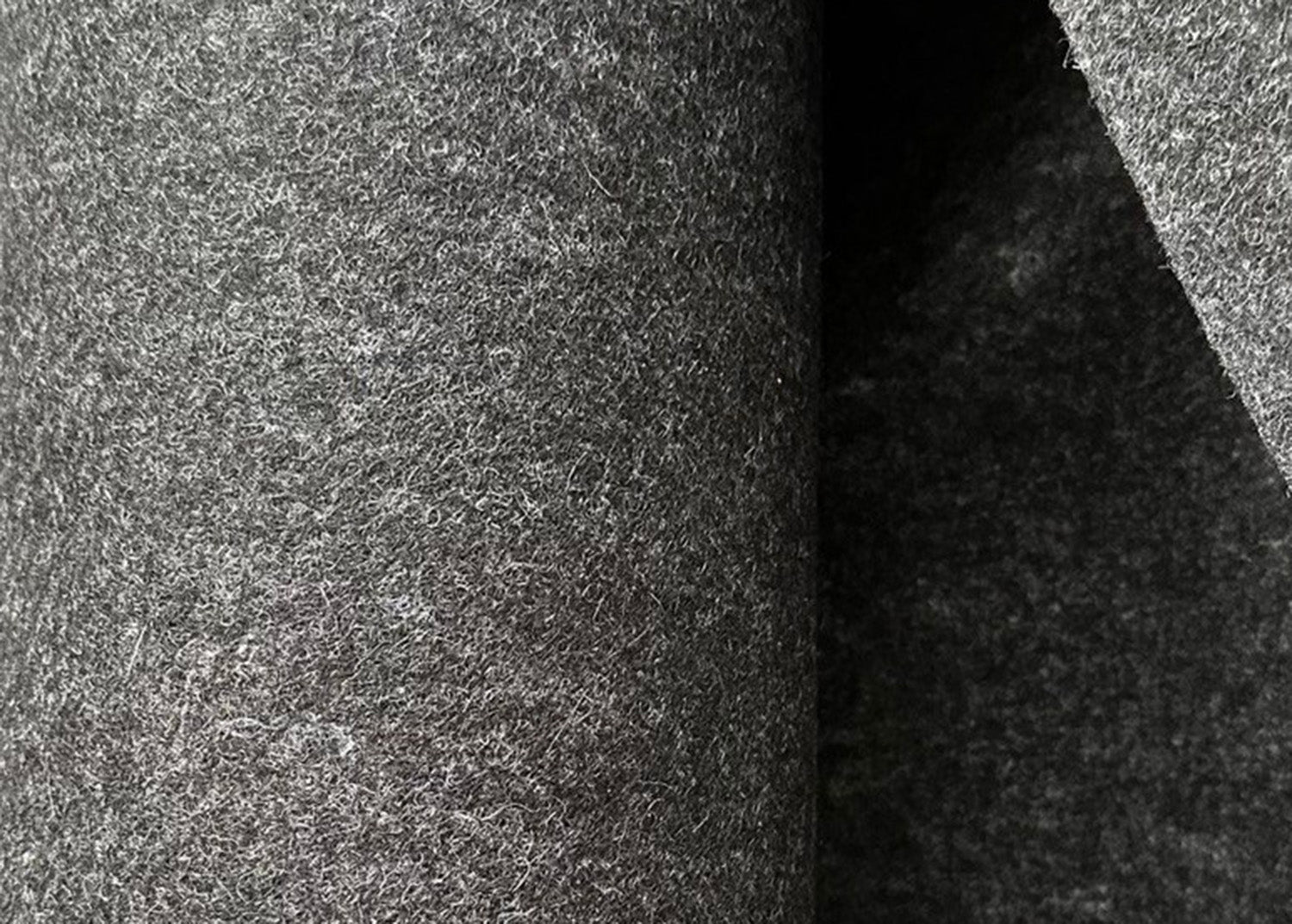 Close-up of grey wool felt material – natural fabric used for macbook cases, desktop iPad stands and Mac Mini accessories