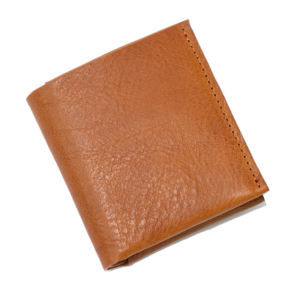 premium leather air tag bi-fold wallet 2.0 for men in cognac brown color made by Geometric Goods
