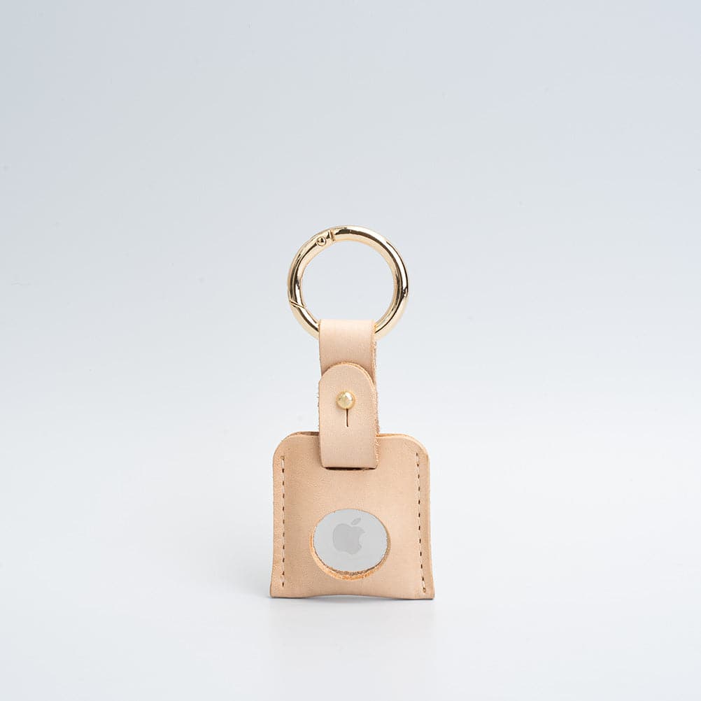 beige leather airtag keyring with golden carabiner