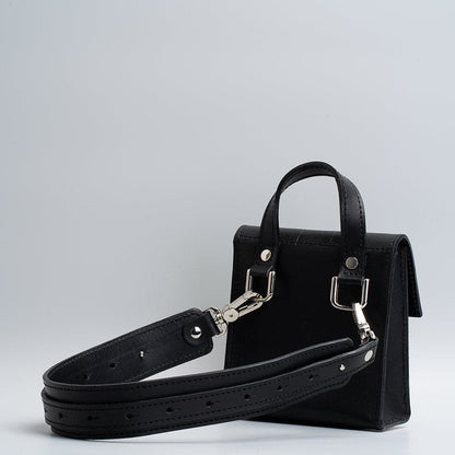 black leather belt bag in geometric design