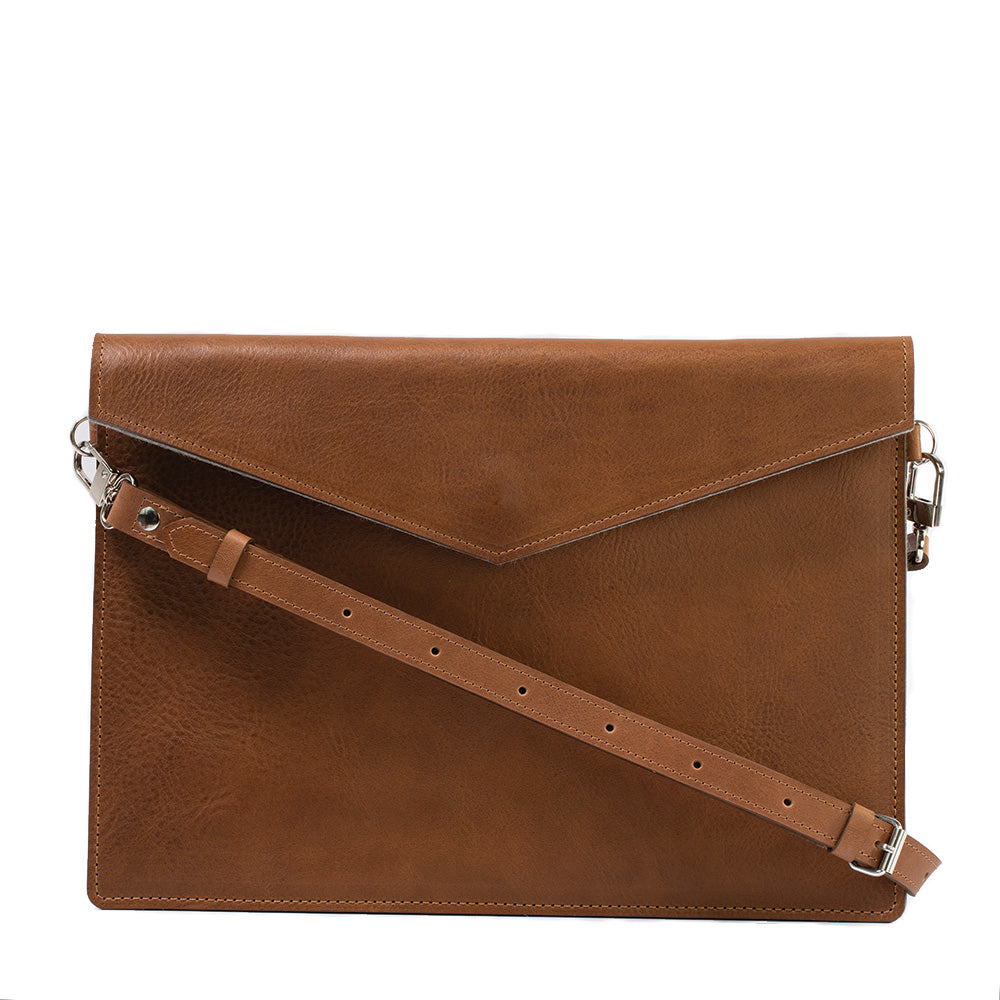 classic brown color Leather Sleeve with adjustable strap for Macbook Air and MacBook Pro made by Geometric Goods from premium quality Italian leather for woman and men 
