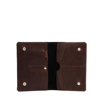 Image of dark brown leather AirTag travel passport wallet crafted be Geometric Goods in Europe for U.S. from premium Italian leather in dark brown mahogany color