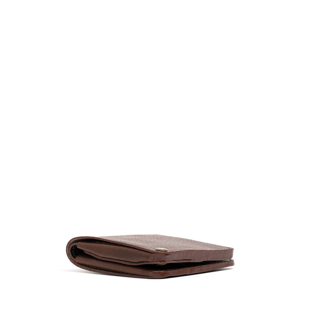 Geometric Goods premium Italian leather AirTag bifold wallet in brown – a stylish tracking solution.
