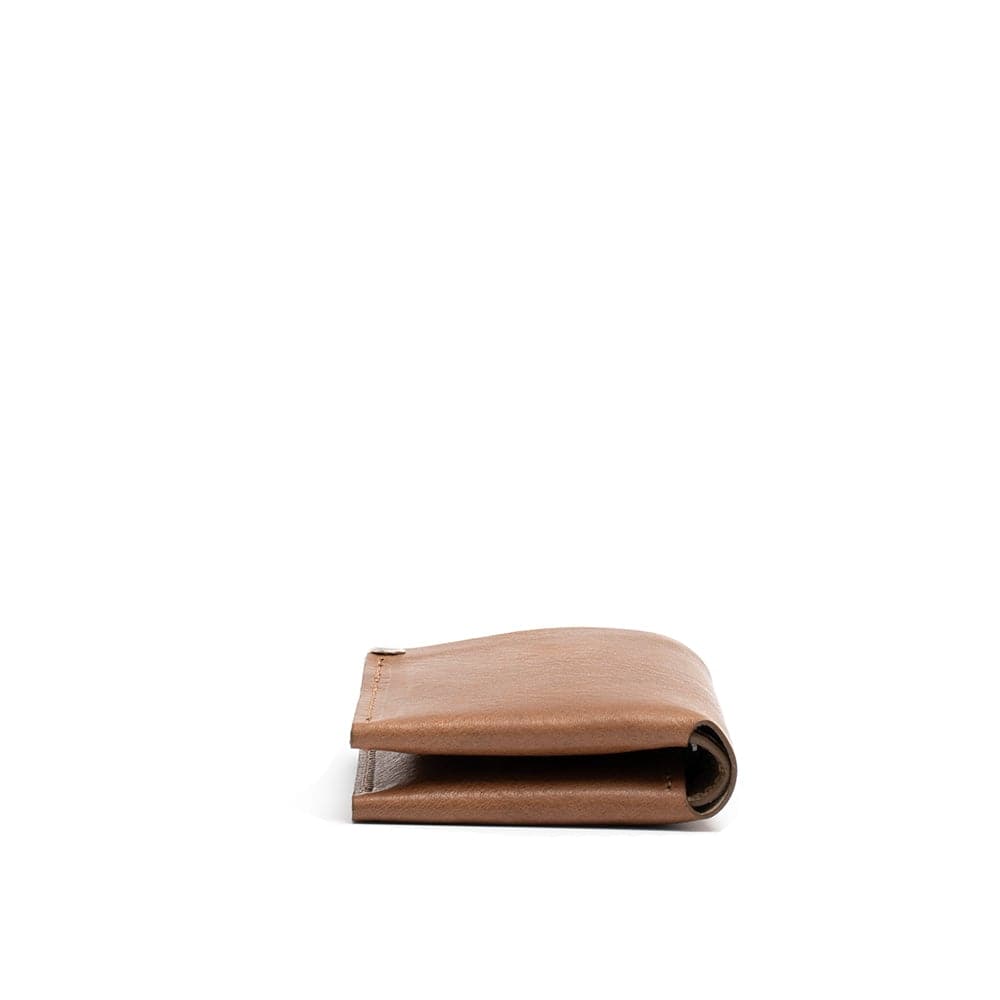 Light brown leather billfold wallet with AirTag