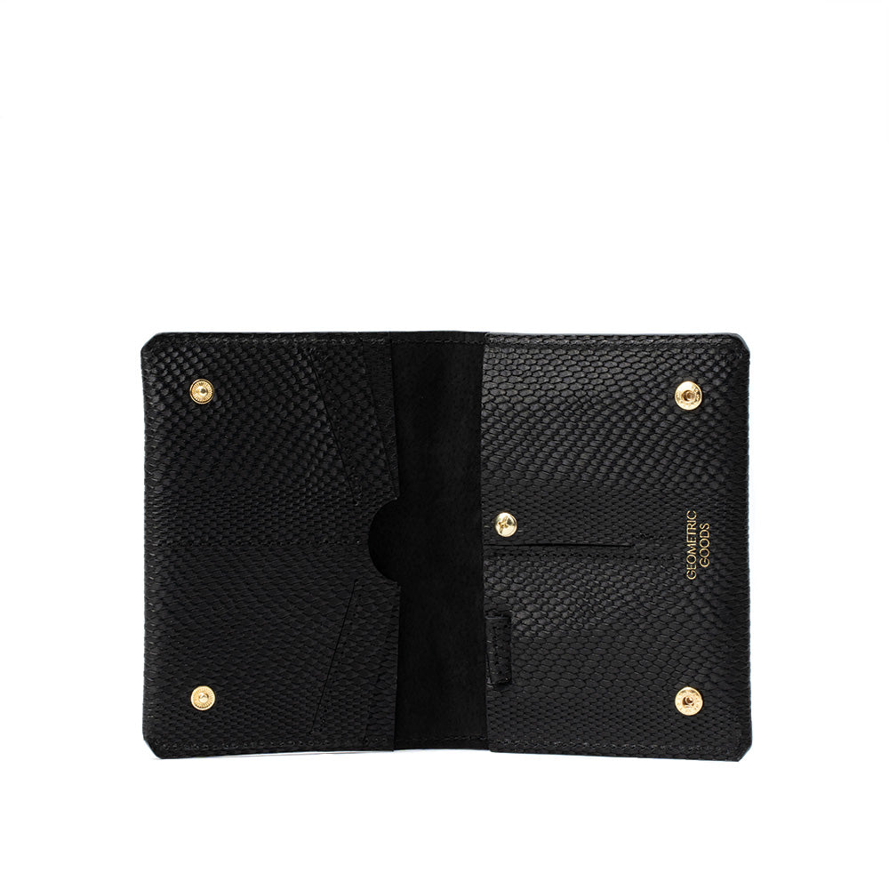 Premium black AirTag passport wallet for man, meticulously crafted by Geometric Goods from Italian leather.