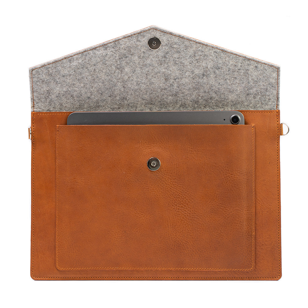tan color leather sleeve bag case for macbook made from premium Italian leather with zipper pocket and iPad pocket with adjustable strap and grey wool felt