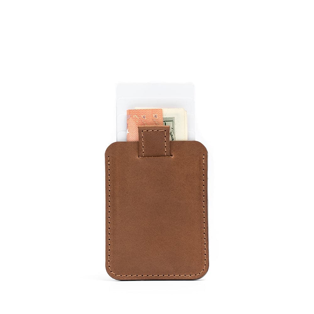 Brown leather MagSafe wallet for iPhone, securely holding up to 6 cards with cash, crafted from premium full-grain leather