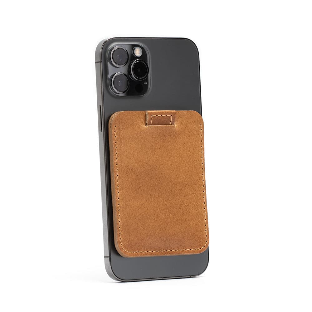 Camel leather MagSafe wallet attached to an iPhone, crafted from premium full-grain leather, holds up to 6 cards securely with MagSafe technology