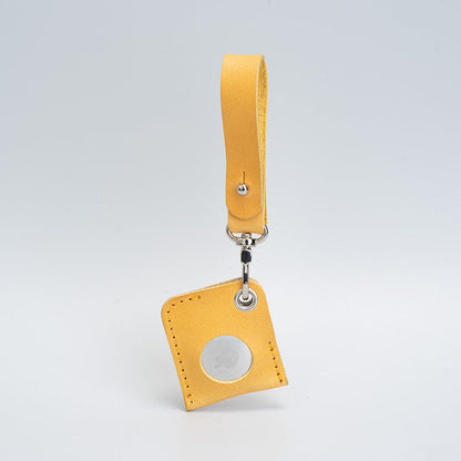 mustard yellow leather airtag bag charm