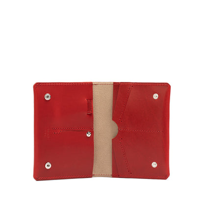 Premium AirTag passport wallet for women in red color, meticulously crafted by Geometric Goods from Italian leather.